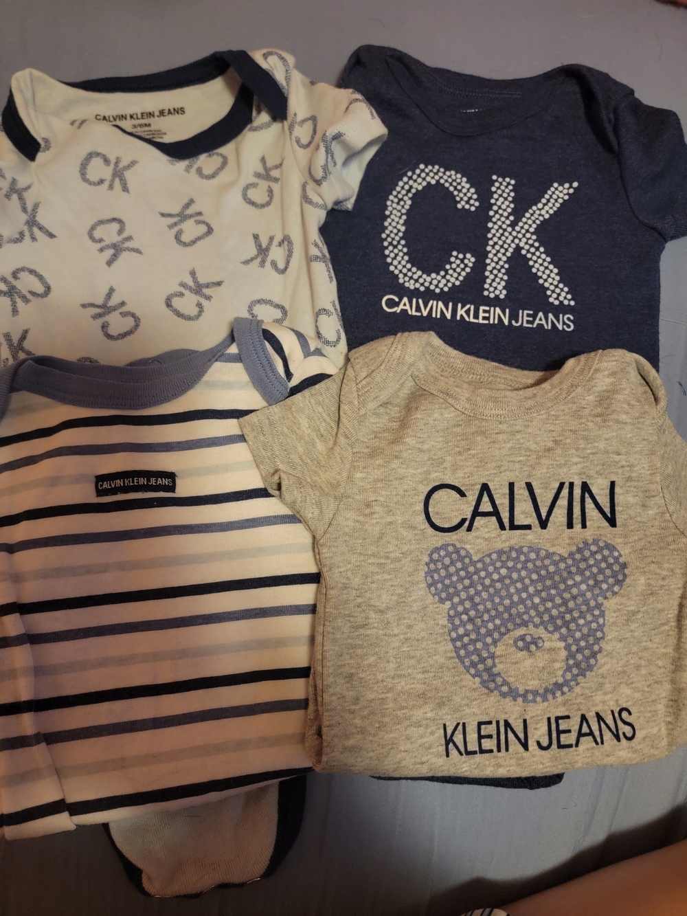 Calvin Klein Jeans Kids 4-Pack Short Sleeve Bodysuits - Navy, Gray, White, Blue
